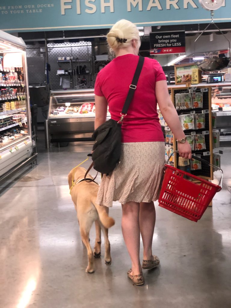 Ruth and Ivan (a yellow lab) shopping at HEB